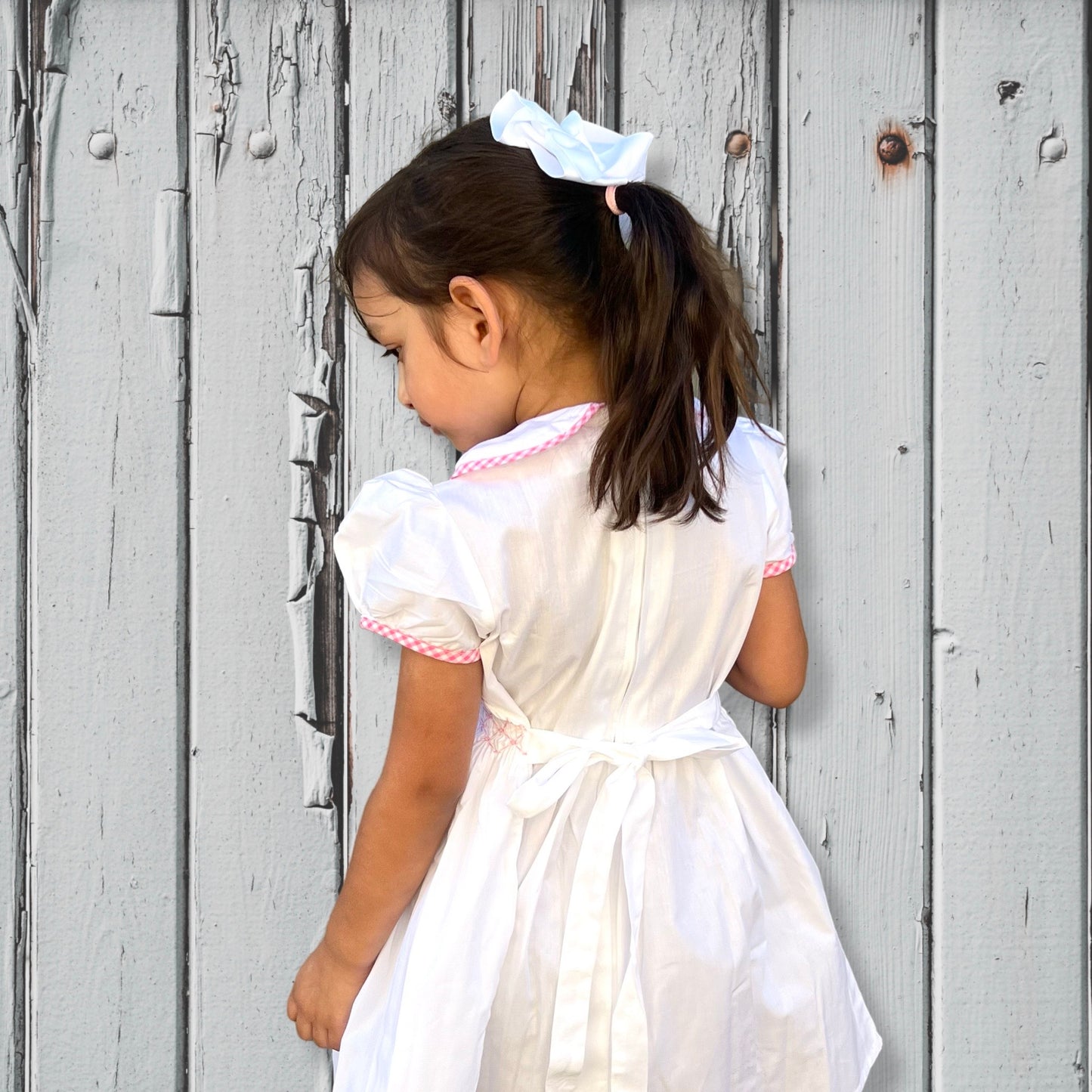 white hand smock dress